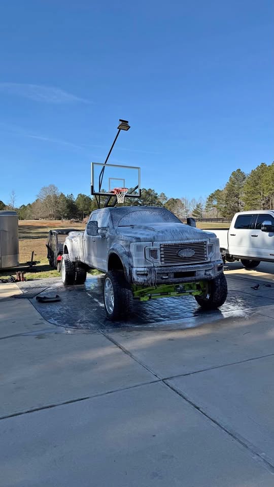 Lifted Ford truck foam wash