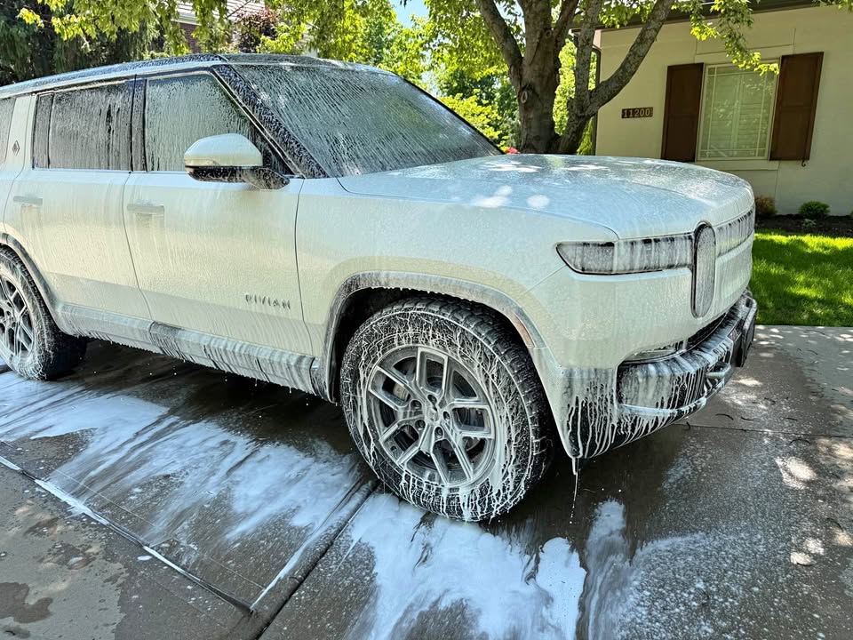 Rivian R1S covered in foam wash